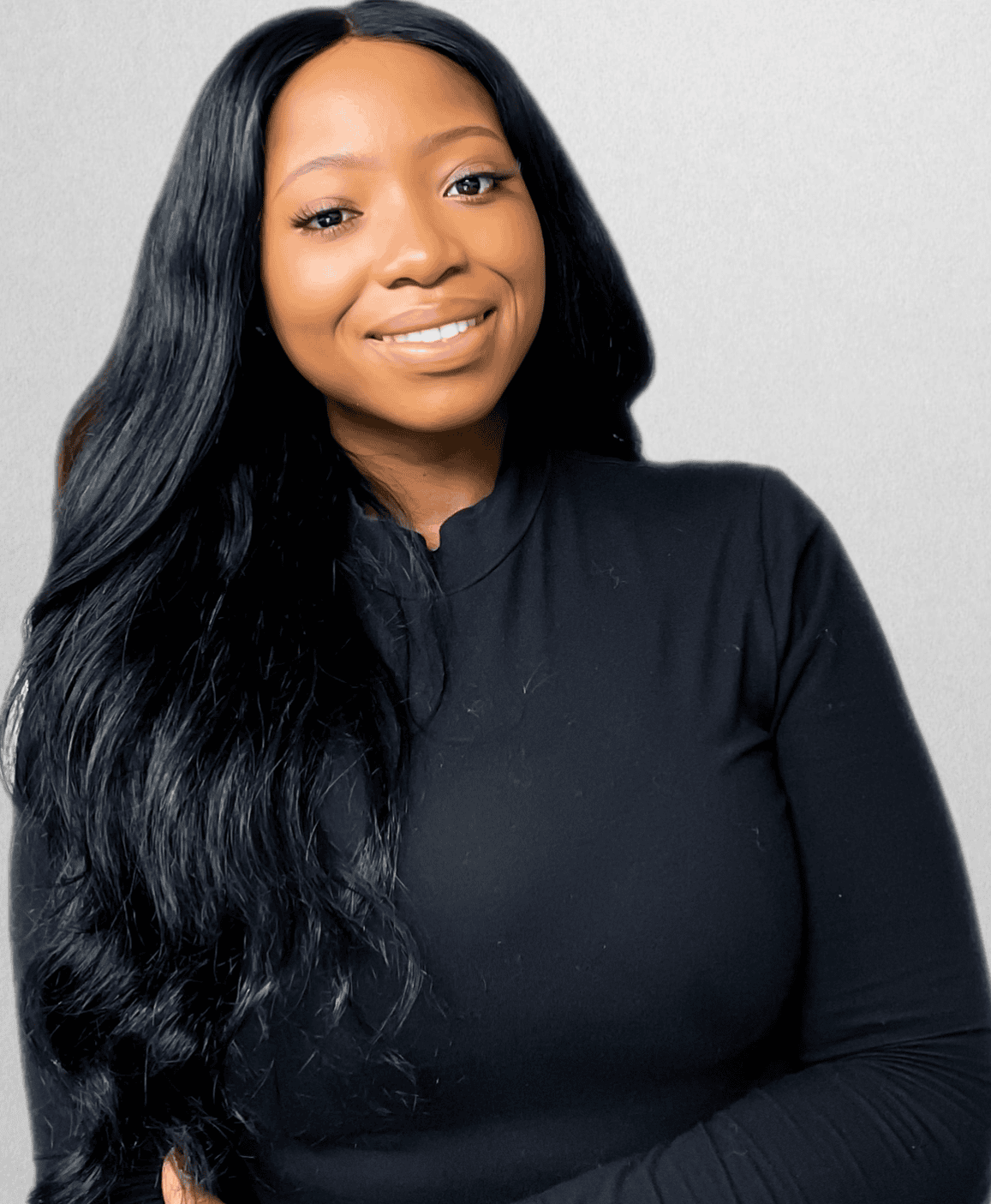 Portrait of a smiling woman with long black hair wearing a black top, representing Equana Minds.